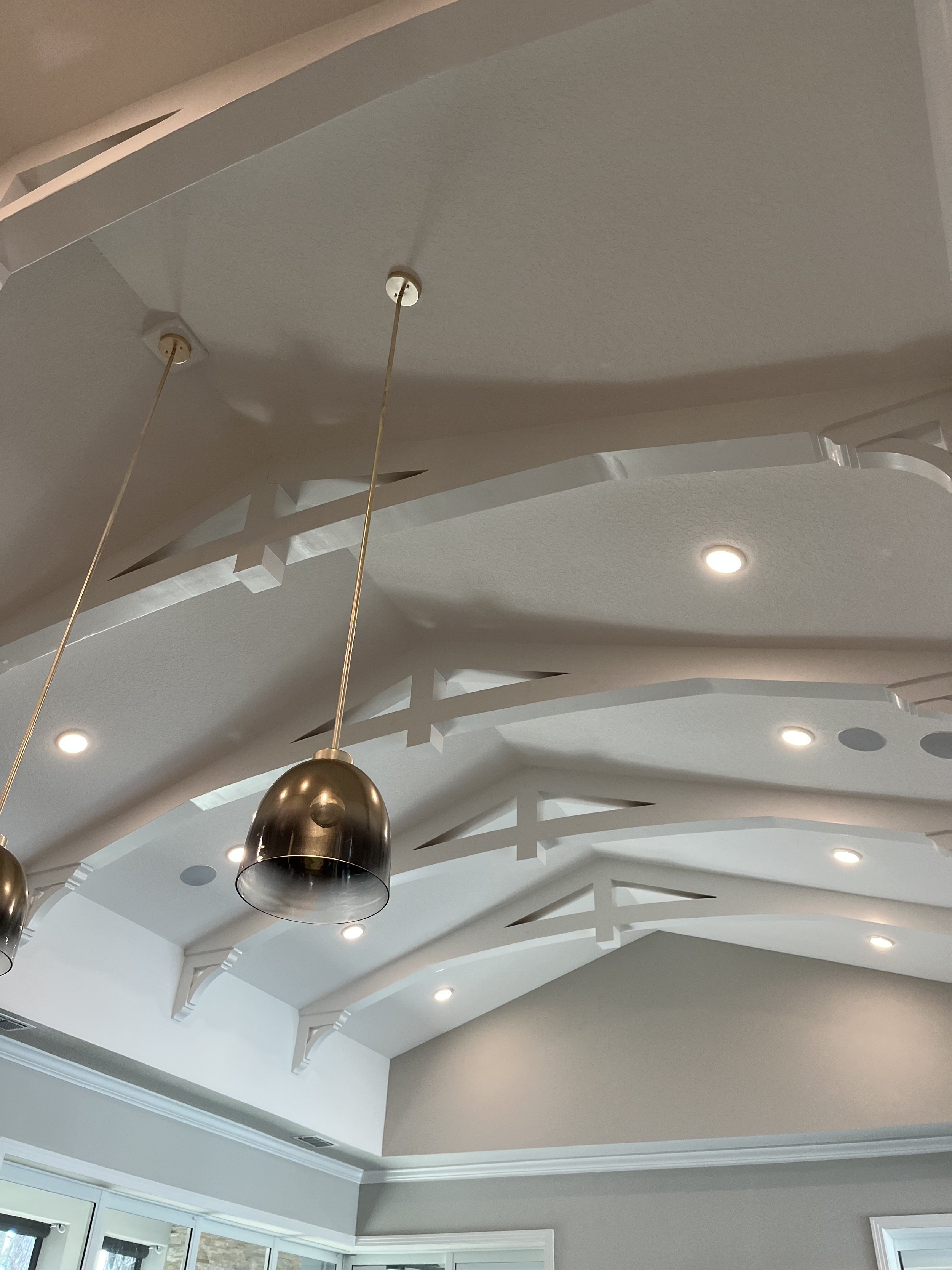 Painted vaulted ceiling and crown trim detail in a home interior